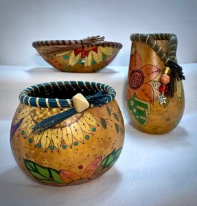 3 decorative gourds with different paint schemes