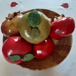A photo of several gourds that have been carved to look like apples