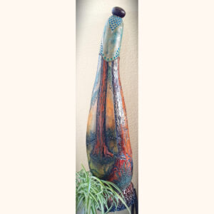 A carved gourd representing redwood trees